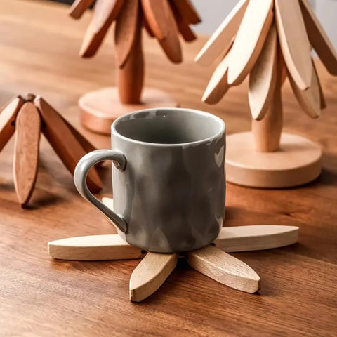 HIQUA teapot resting on trivet, safeguarding countertops from heat.