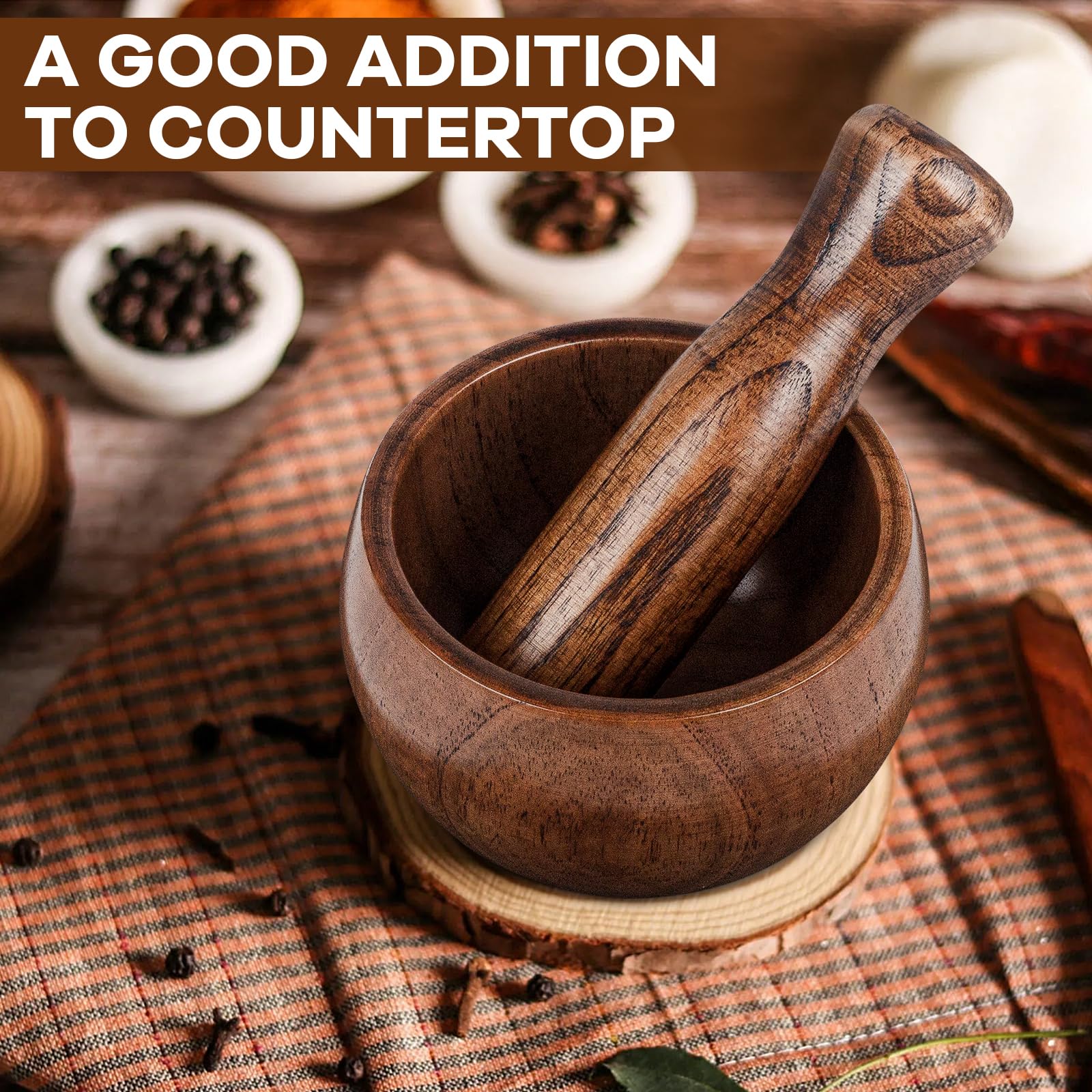 Hisite acacia mortar pestle on a modern kitchen counter.