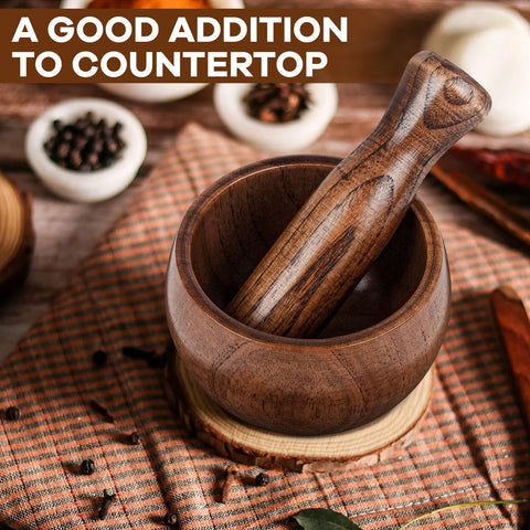 Hisite acacia mortar pestle on a modern kitchen counter.