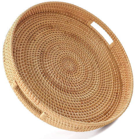 Hitomen round rattan tray top view with handles for effortless serving on a coffee table.