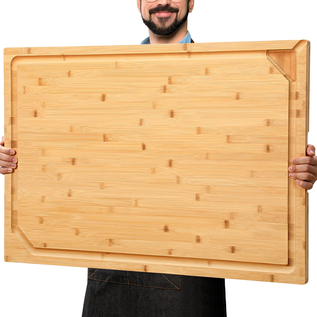 Hiware 30x20 extra-large bamboo cutting board on stove offers expansive prep space.