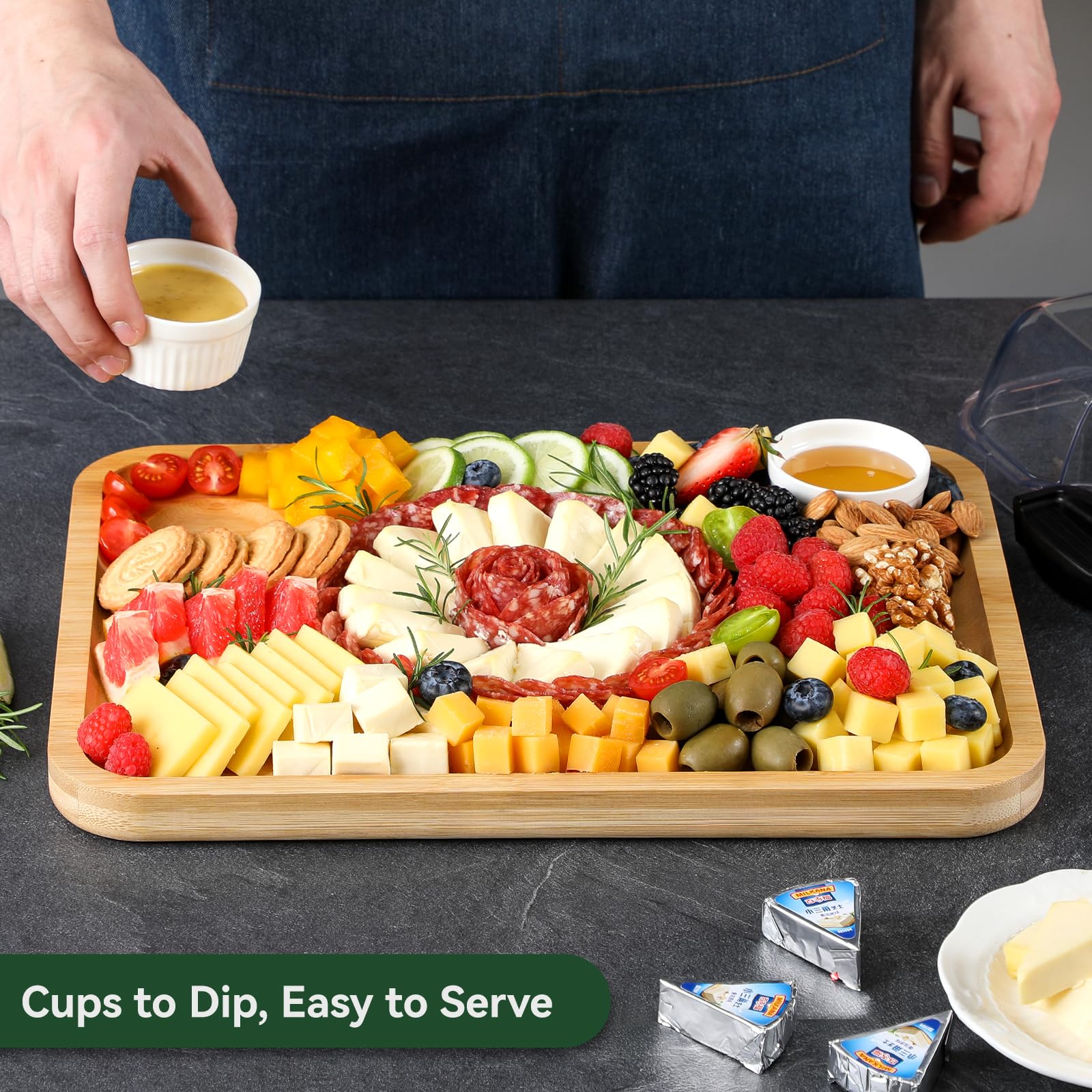 HIWARE charcuterie board with lid handle facilitates easy transport and serving.