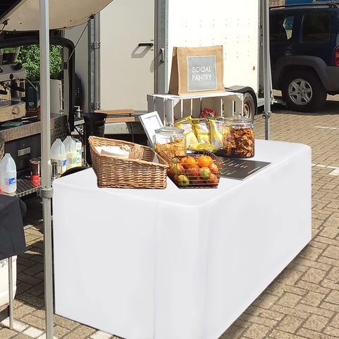 HolidayIdeas fitted white tablecloth machine-washable for easy post-event cleanup.
