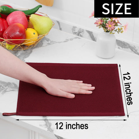 Homaxy burgundy kitchen dishcloth in use for scrubbing pans and countertops.