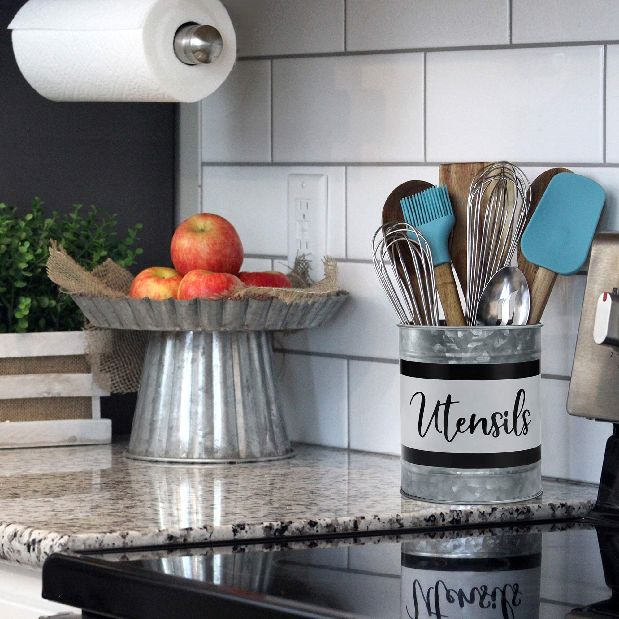 Home Acre Designs farmhouse utensil caddy on counter enhances style.