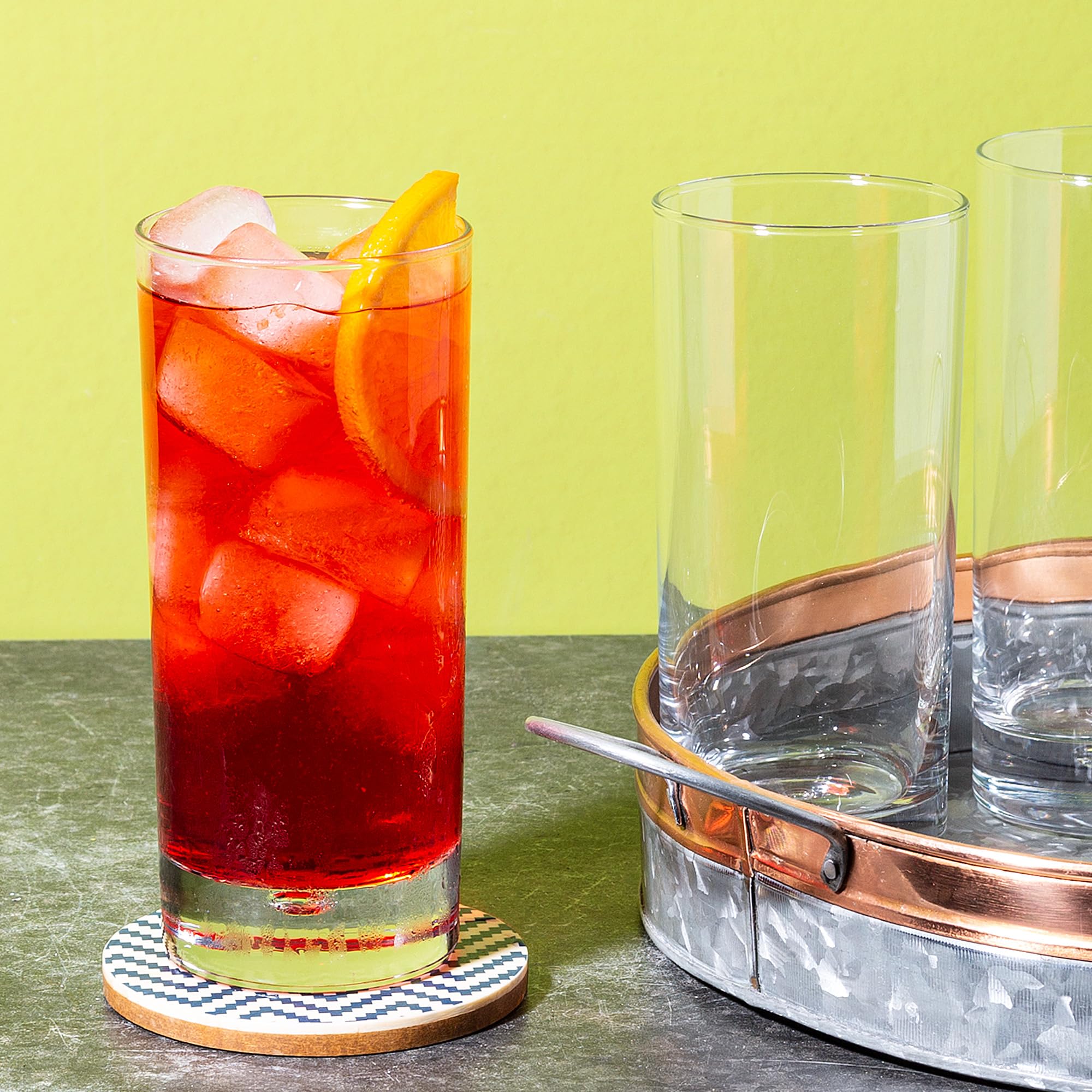 Home Essentials & Beyond highball glasses in outdoor dining settings.