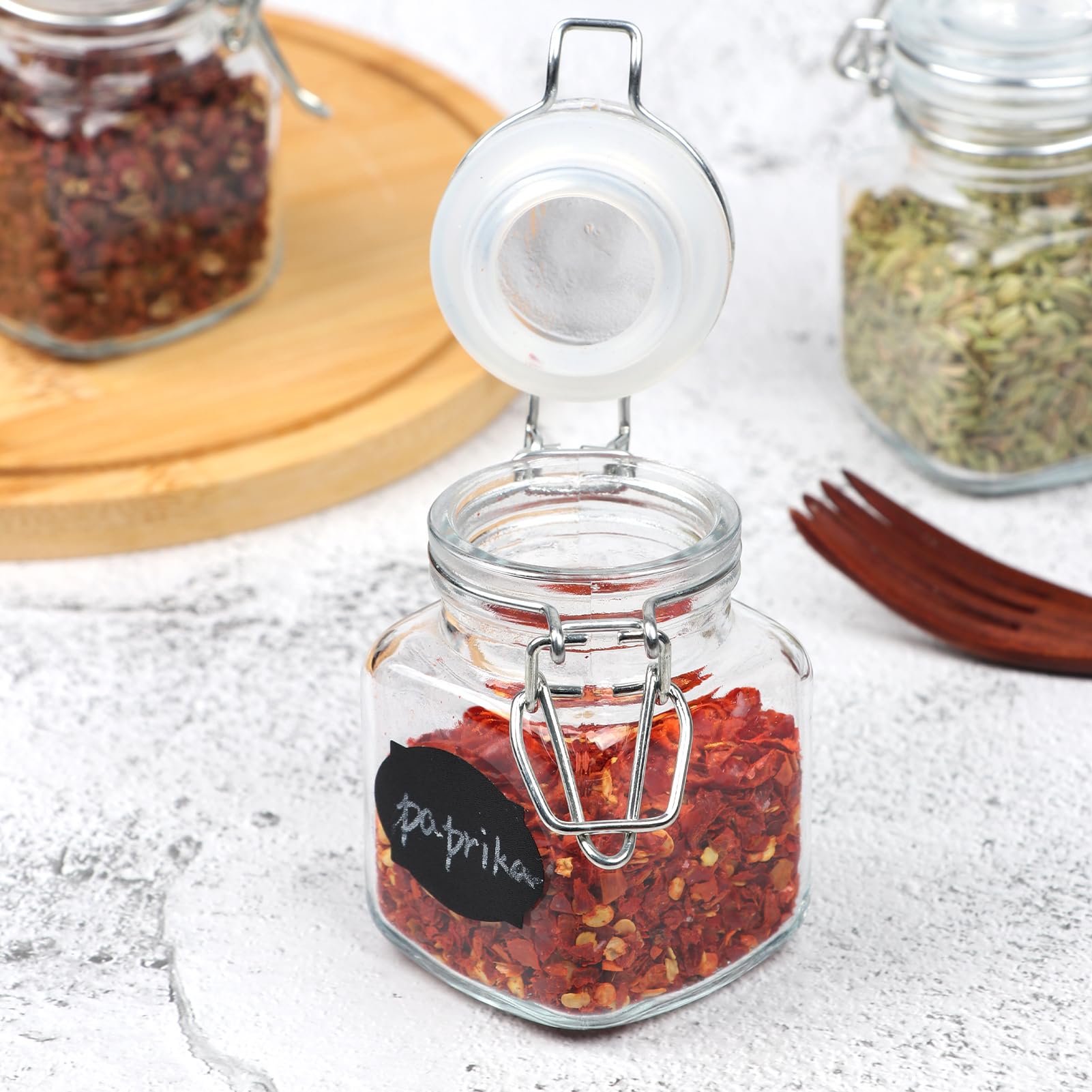 Homelike Style 3.4 oz jars neatly arranged on a kitchen shelf for compact storage.