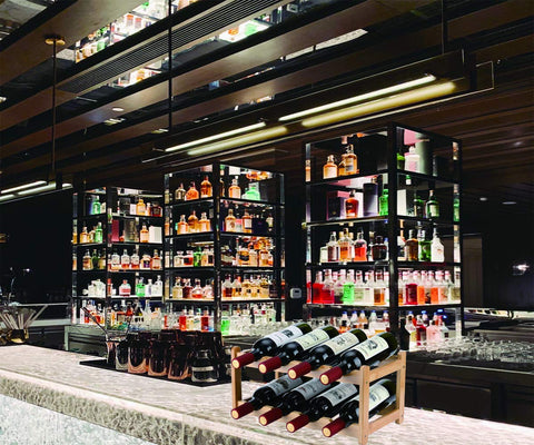 Homevany countertop wine organizer placed on a kitchen island for easy reach