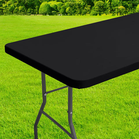 Homing rectangle table cloth cover with elastic edge secures an 8-foot table outdoors.