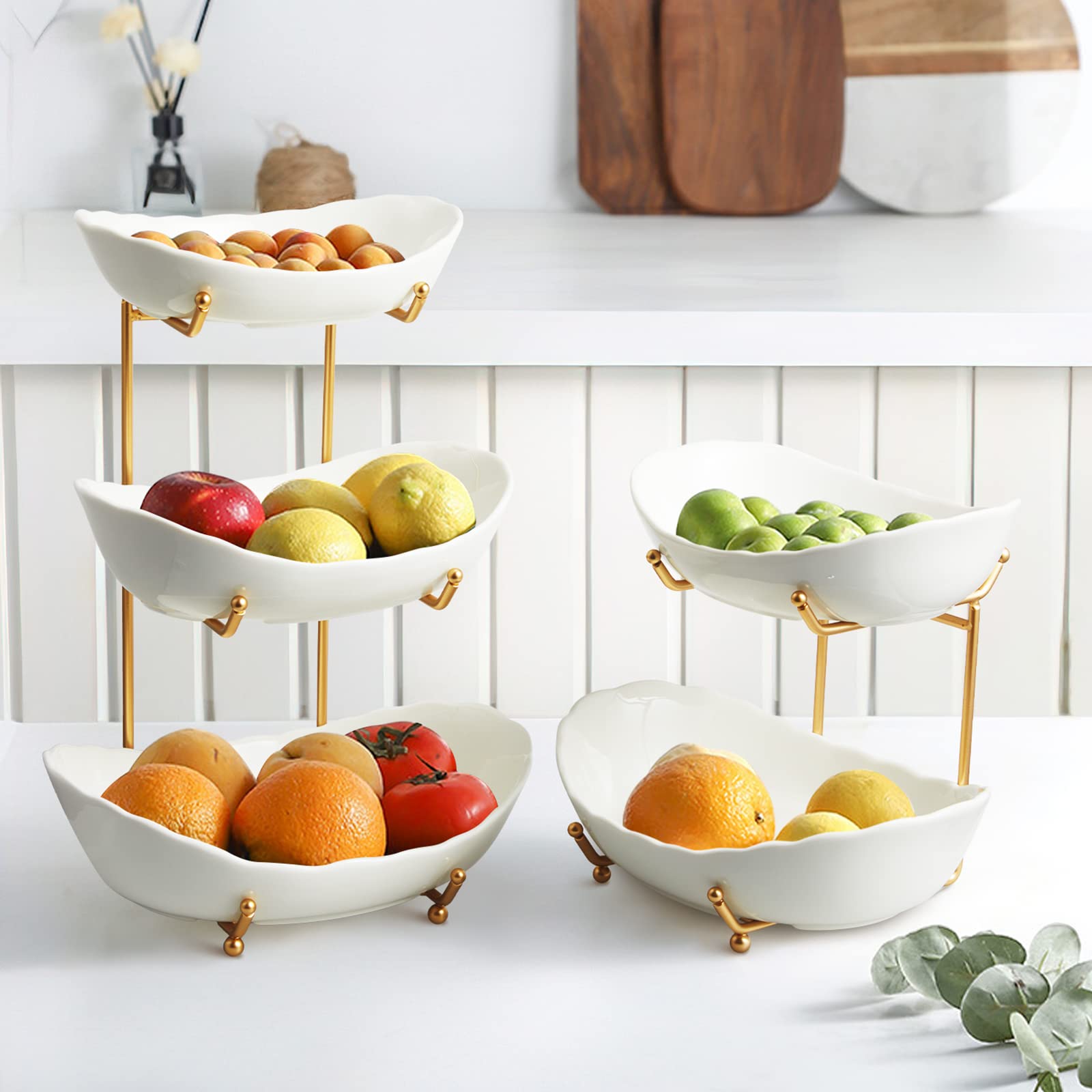 HOMKULA gold metal stand elevates the ceramic bowls with a modern touch.