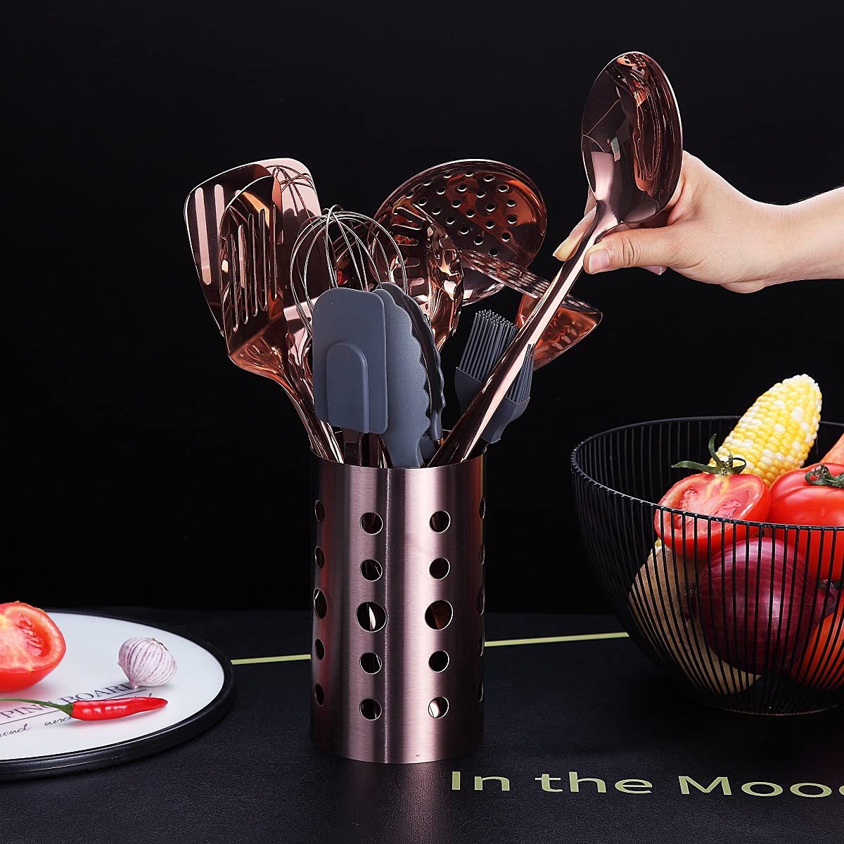 HOMQUEN utensil holder keeps tools organized and within easy reach.