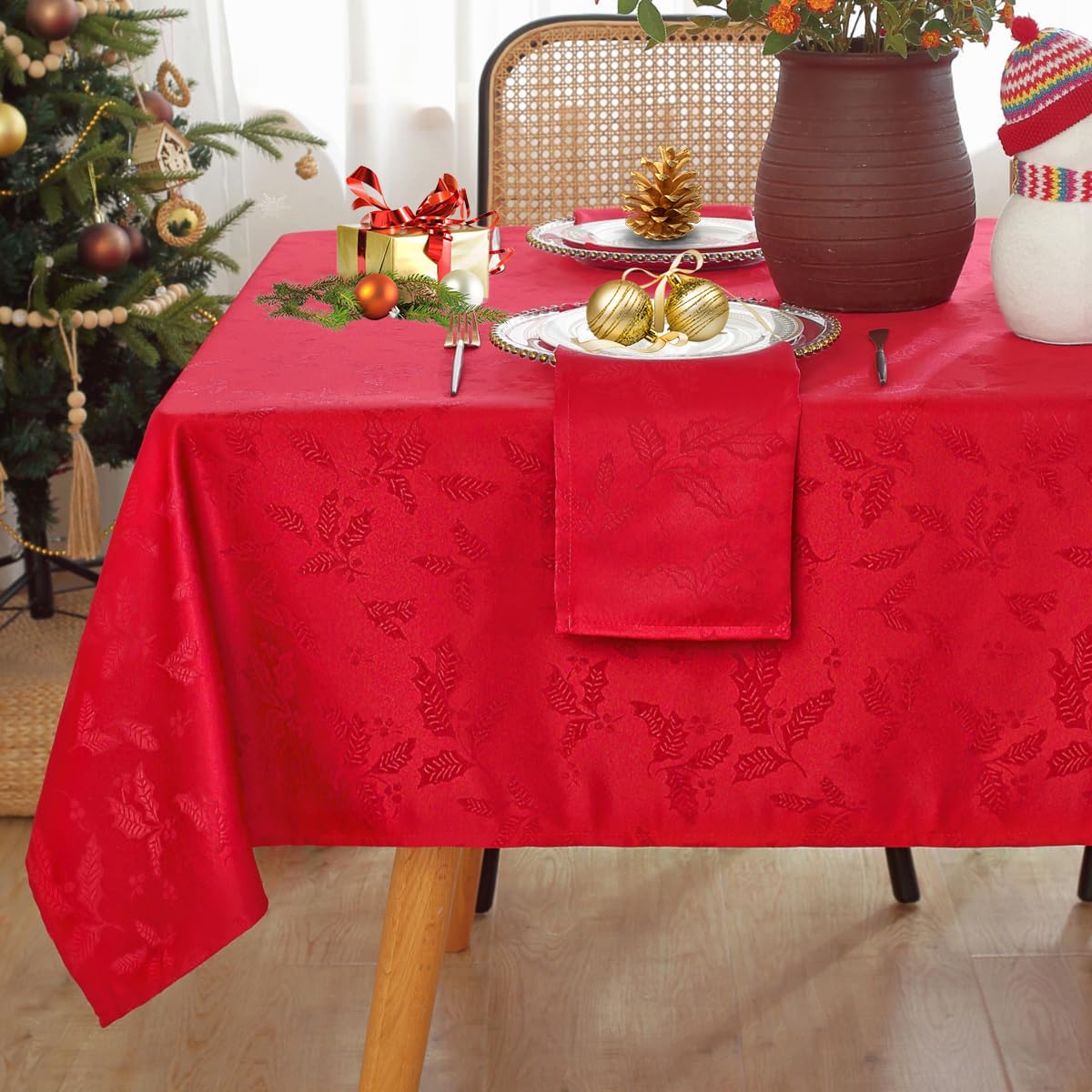 Honellaty Christmas table setting with red tablecloth creates a warm dining ambiance.