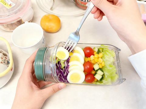 HongzyFirm microwave-safe container for reheating lunches with lid removed.