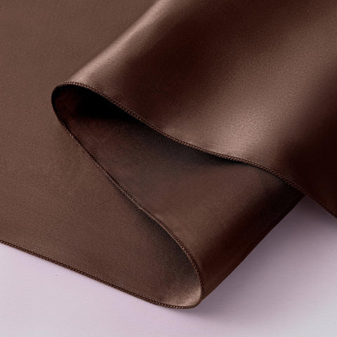 Horbaunal satin runner creates sophisticated ambiance for party tables.