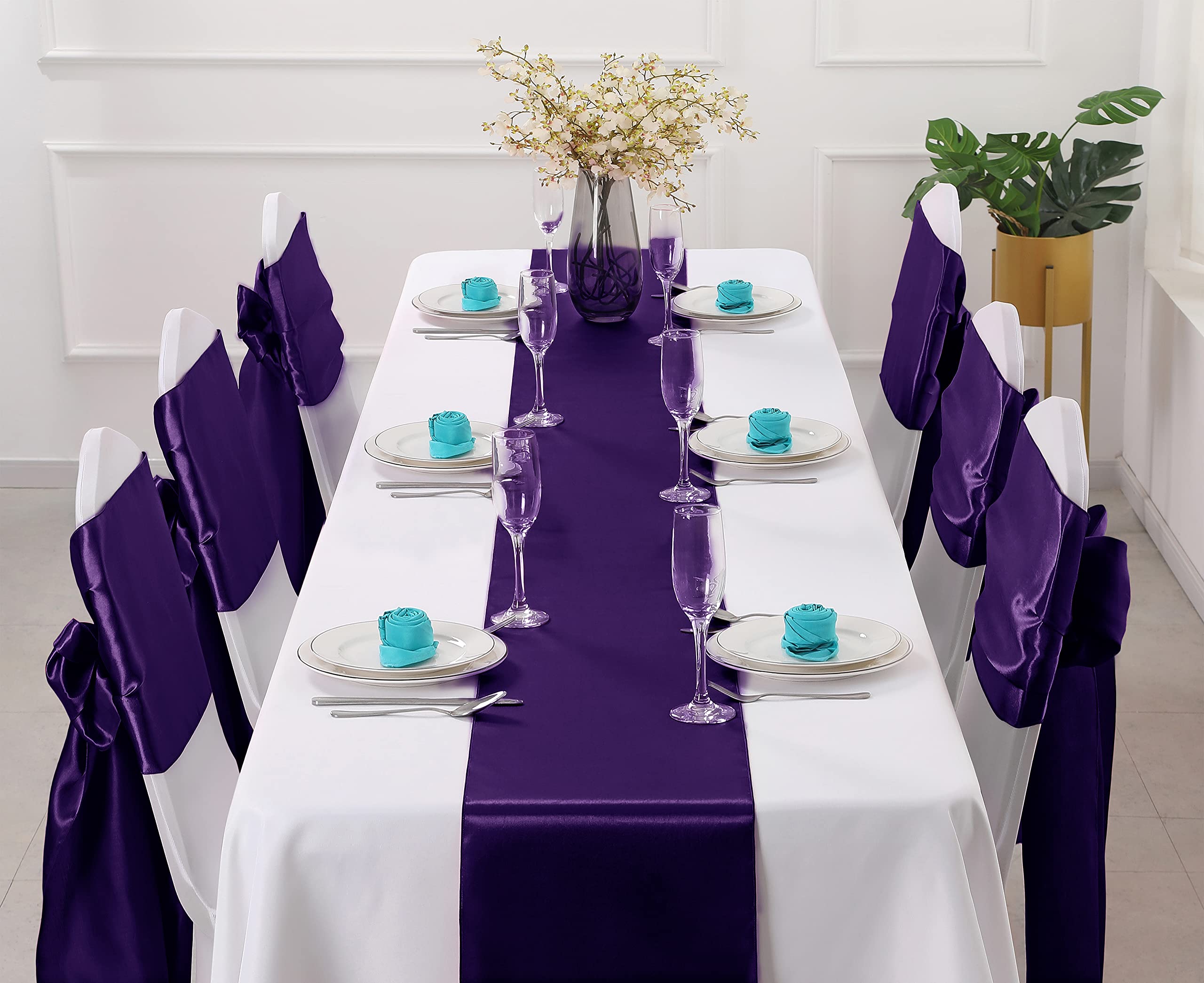 Horbaunal purple satin table runner draped on a table for elegant setup.