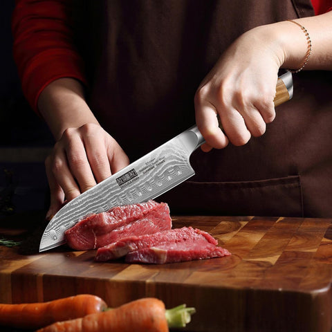 Ergonomic grip on the HOSHANHO Santoku Knife for steady control during prep