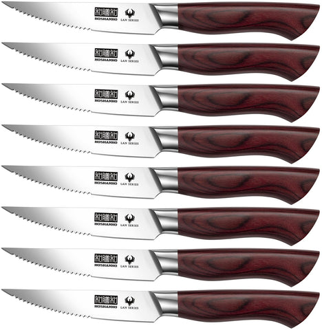 HOSHANHO 8-piece steak knife set on display for dinner service, precise slicing.