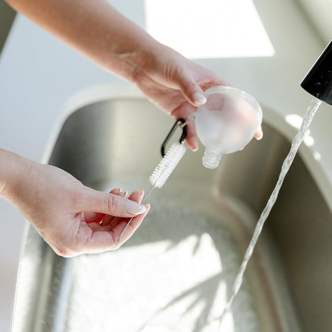 HOSHI HEALTH mess-free pouring demonstrated on the go.