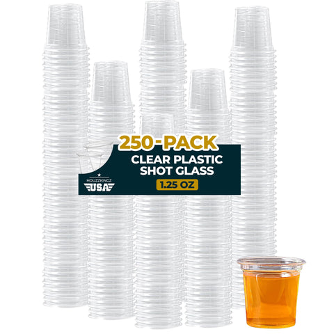 Houzzkingz USA clear 1.25 oz shot glasses displaying vibrant drinks at parties.
