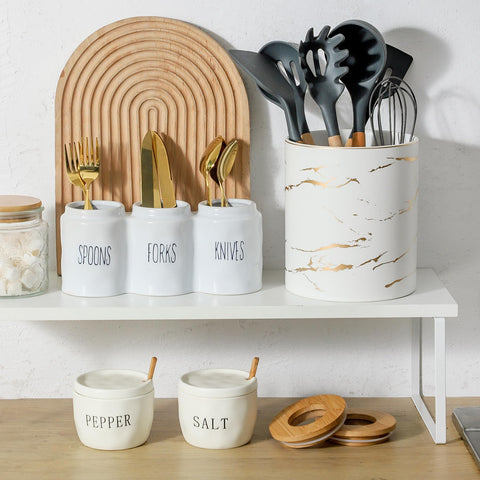 Howise salt pepper bowls with lids and spoon storage solution.