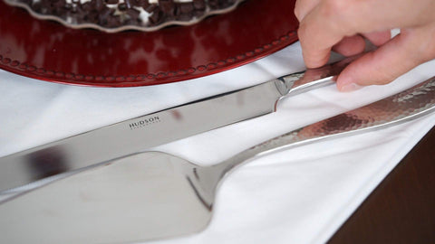 Hudson Essentials precision balance aids smooth controlled cake cuts for celebrations.