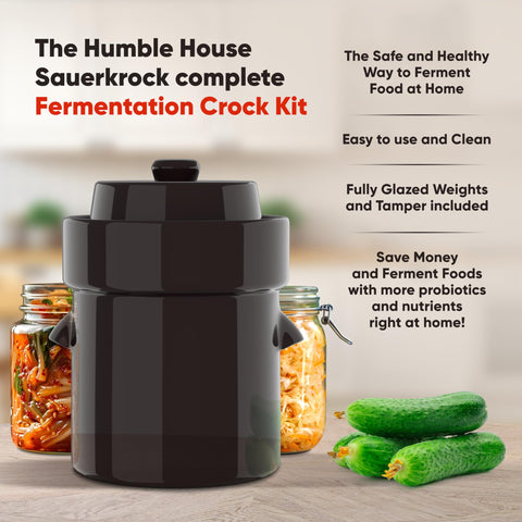 Humble House green crock with lid and weights, demonstrates submersion and brine control.