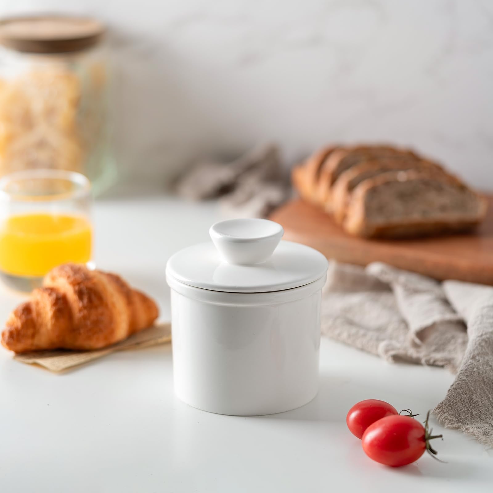 Open-lid display of soft, ready-to-spread butter in Husfunov crock