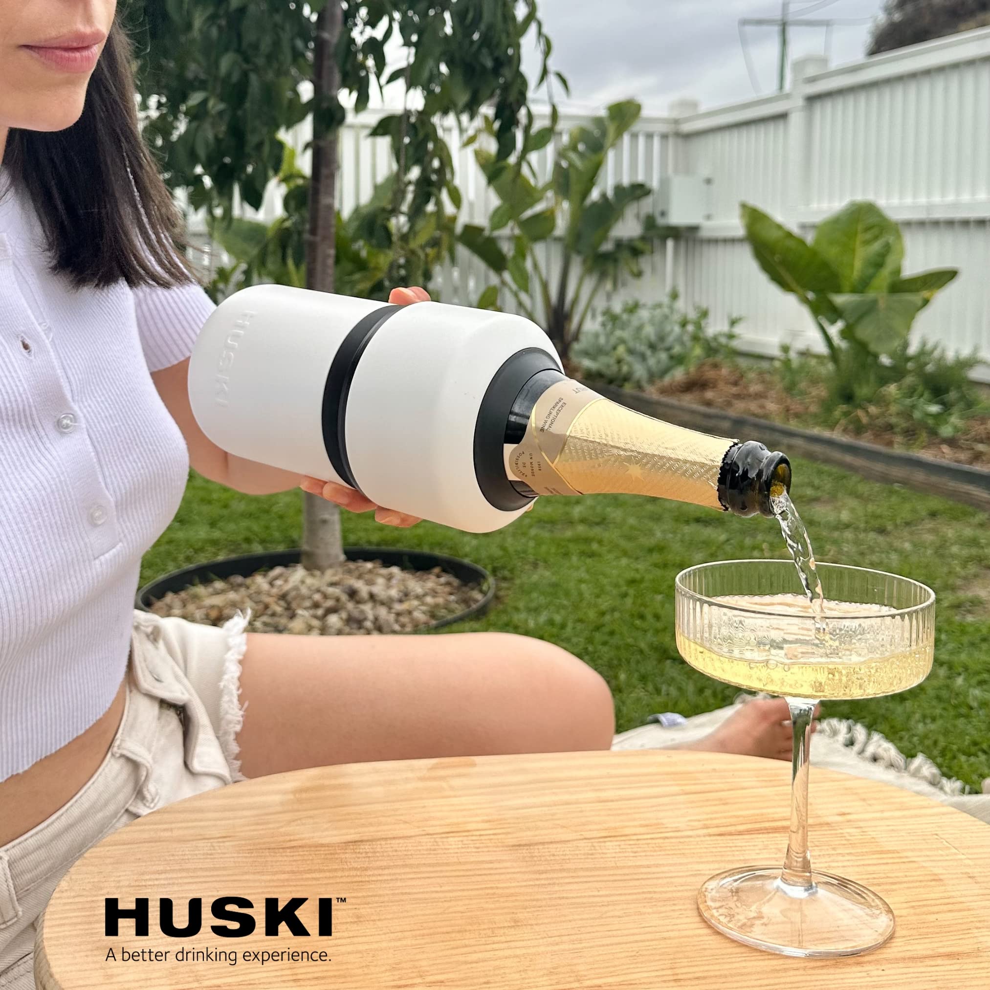 Huski wine chiller in use at barbecue shows versatility outdoors.