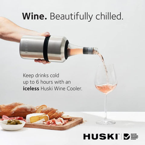 Huski wine chiller shown during pouring with secure fit and spill-free service.