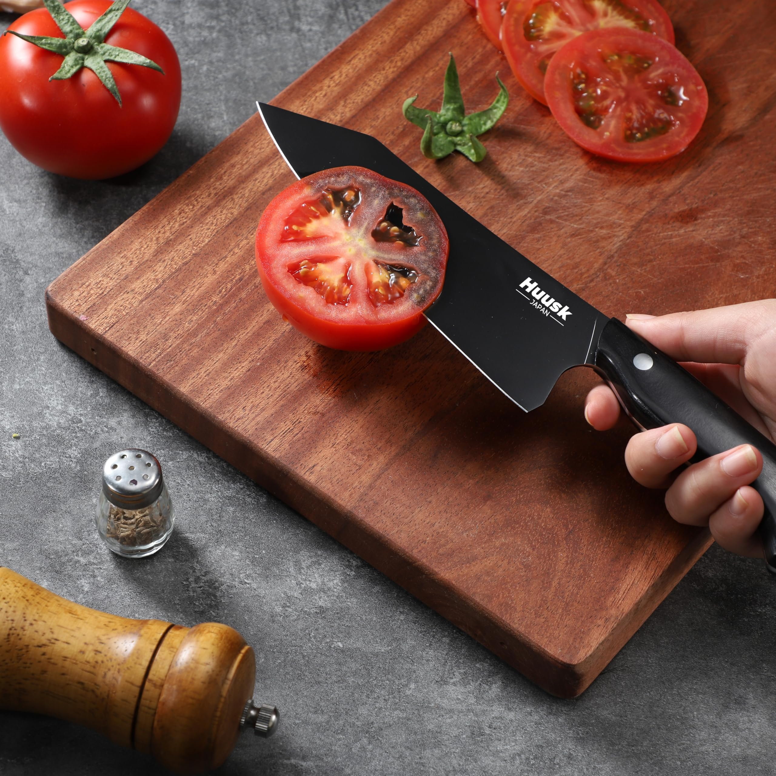 Huusk blade gliding cleanly through food for effortless cuts