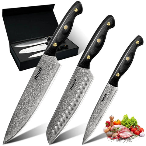 Huusk Damascus chef knife set with ebony handle for precise cutting.