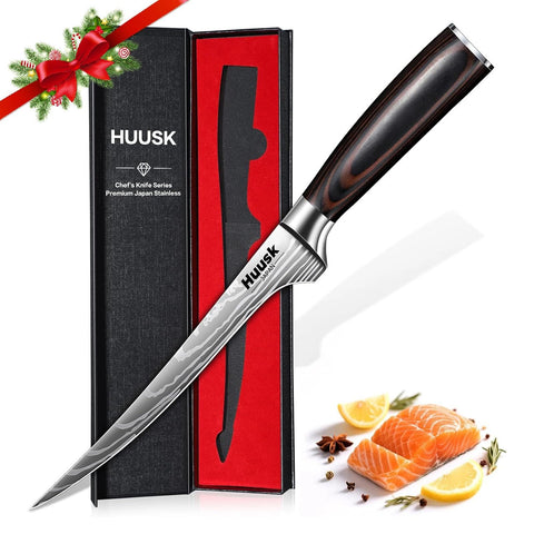 Huusk Filet Knife with wood handle close-up highlighting premium craftsmanship and grip.