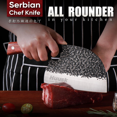 Huusk Serbian chef knife slicing meat with precision and control.