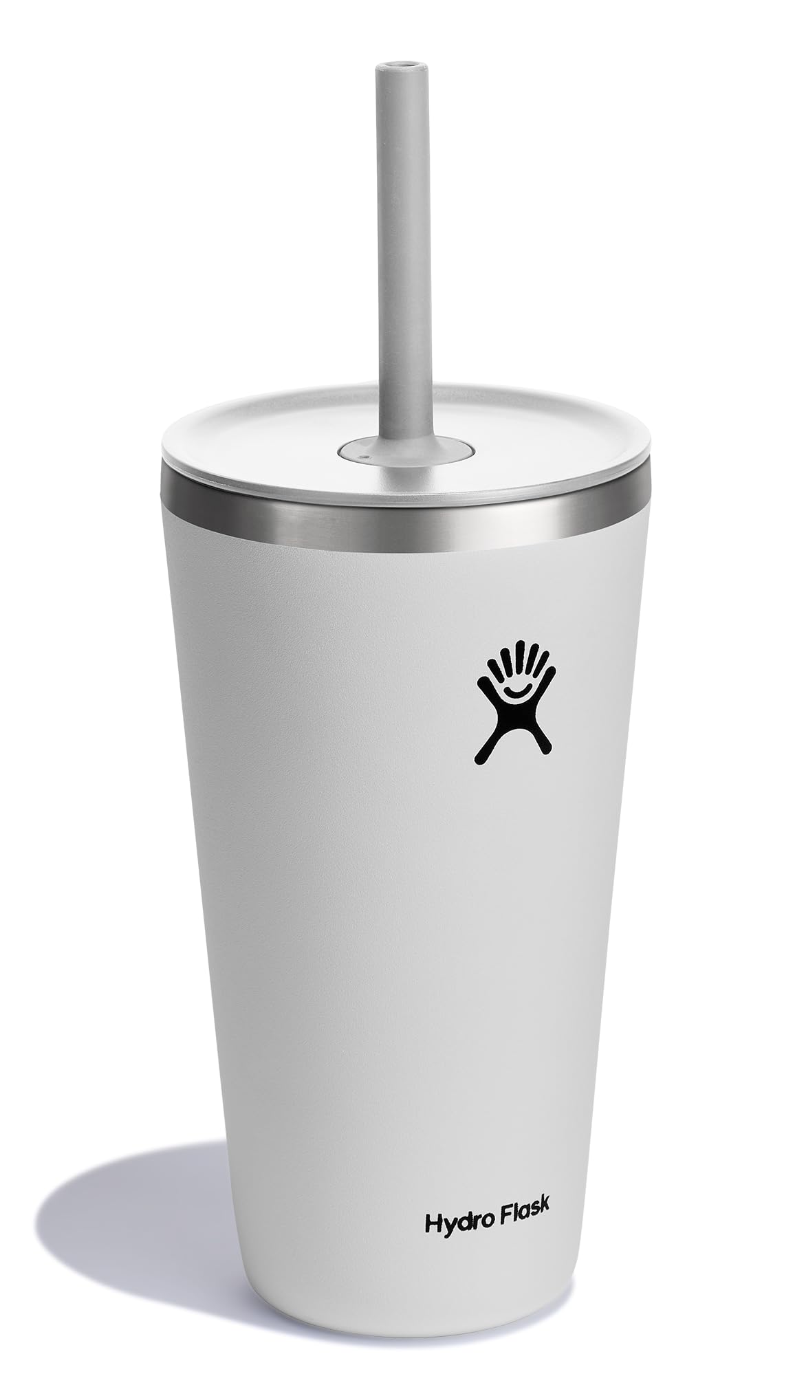 Hydro Flask white tumbler with straw lid in hand, ideal for on-the-go hydration