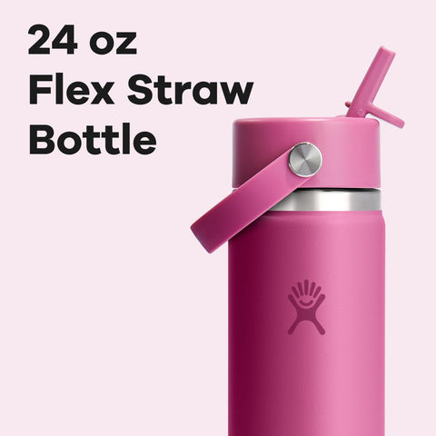 Hydro Flask bottle resting in a car cupholder in reef pink.