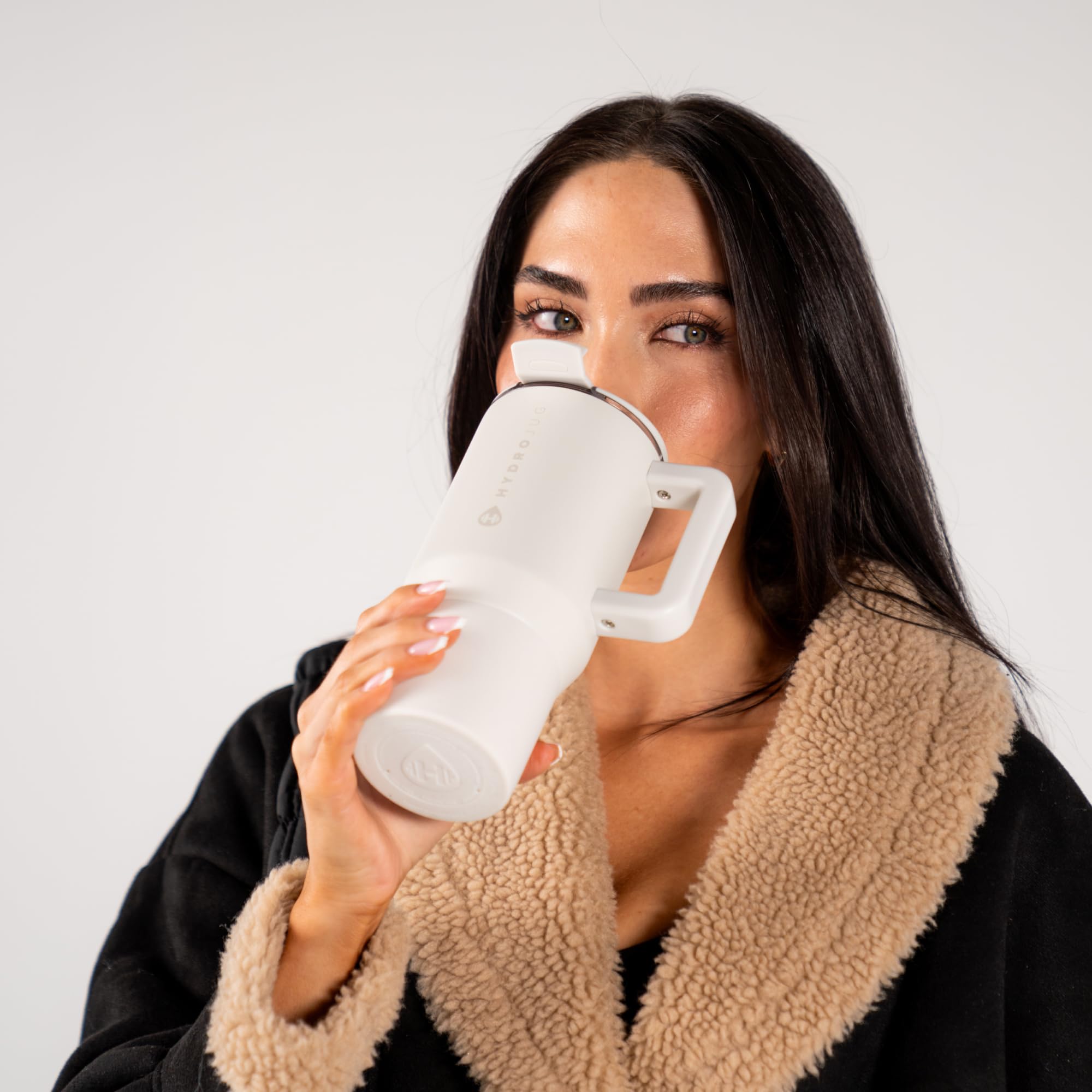 HydroJug Coffee Traveler 20 oz in use during commute or desk days.