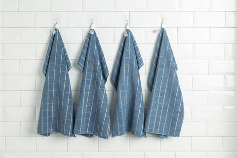 HYER KITCHEN towel absorbency test with water droplets demonstrating quick uptake.