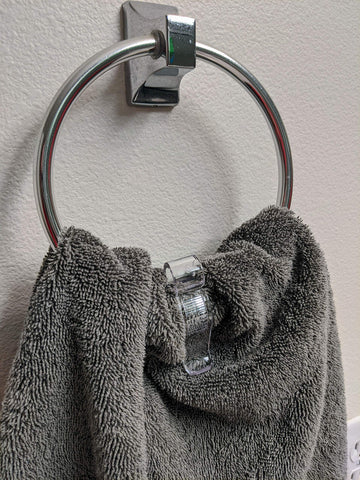 Iba Innovations Towel Clip clear polycarbonate finish adds subtle organization.