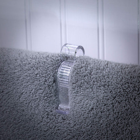 Iba Innovations Towel Clip in bathroom scene keeps hand towels in place.
