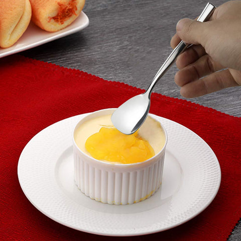 Idomy spoons on wood board display versatile tableware setup