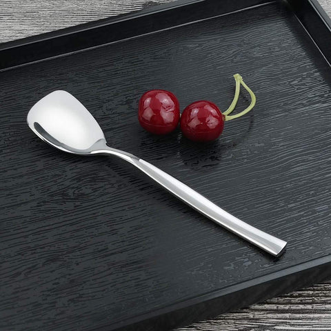 Idomy spoons beside coffee cup demonstrate perfect match for cappuccino and desserts