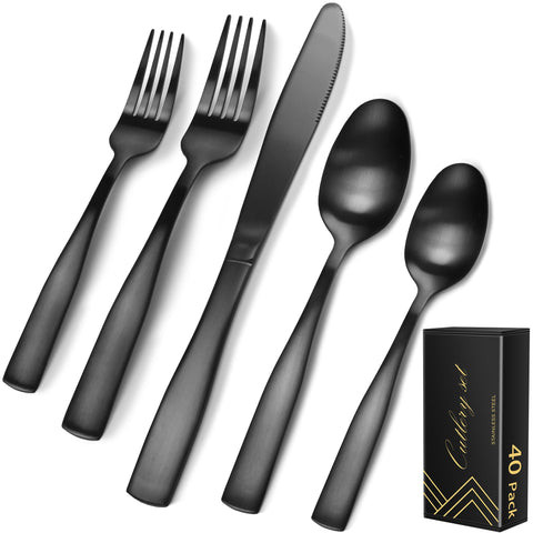 IFERRENS matte black silverware set laid out for eight on a modern dining table.