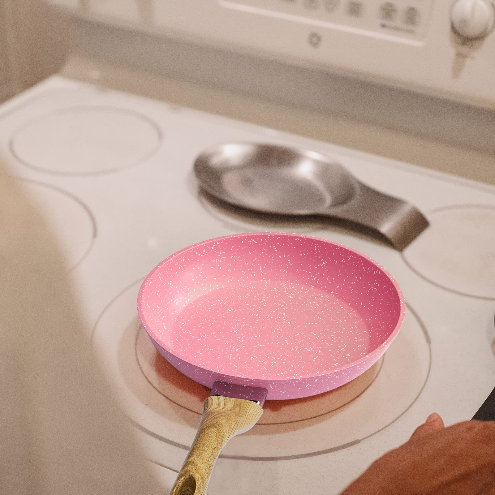 Anti-warp base of Innerwell pink egg pan provides durable heat distribution.