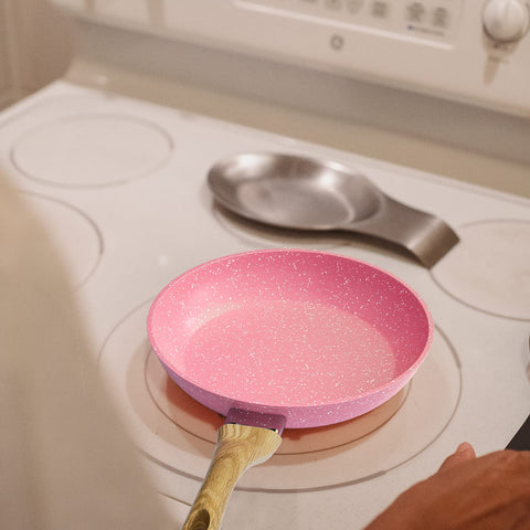 Anti-warp base of Innerwell pink egg pan provides durable heat distribution.