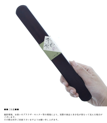 Ishida Daruma case in hand, travel-ready storage