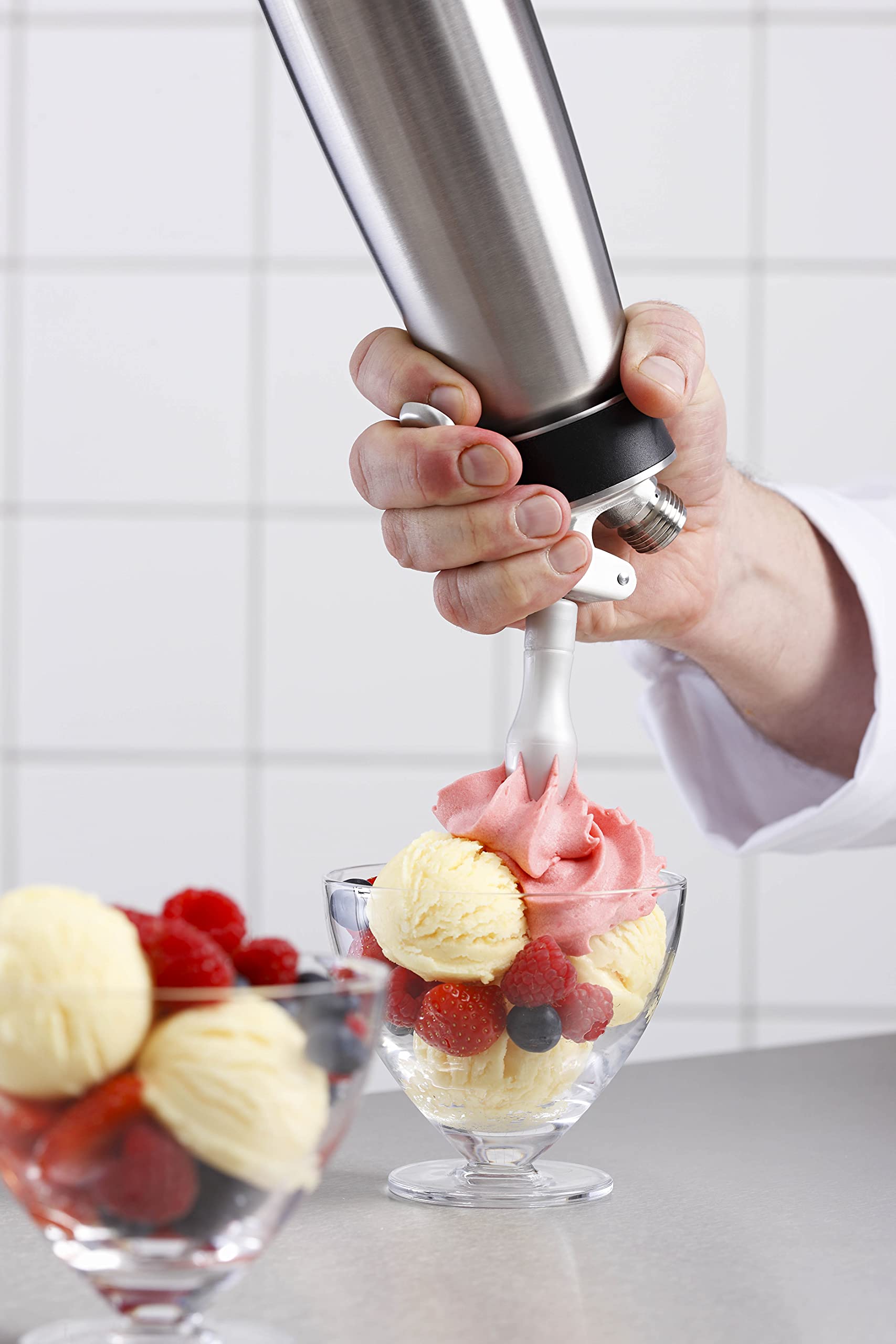 Isi North America Cream Profi Whip used for cold dessert toppings in a cafe setting.