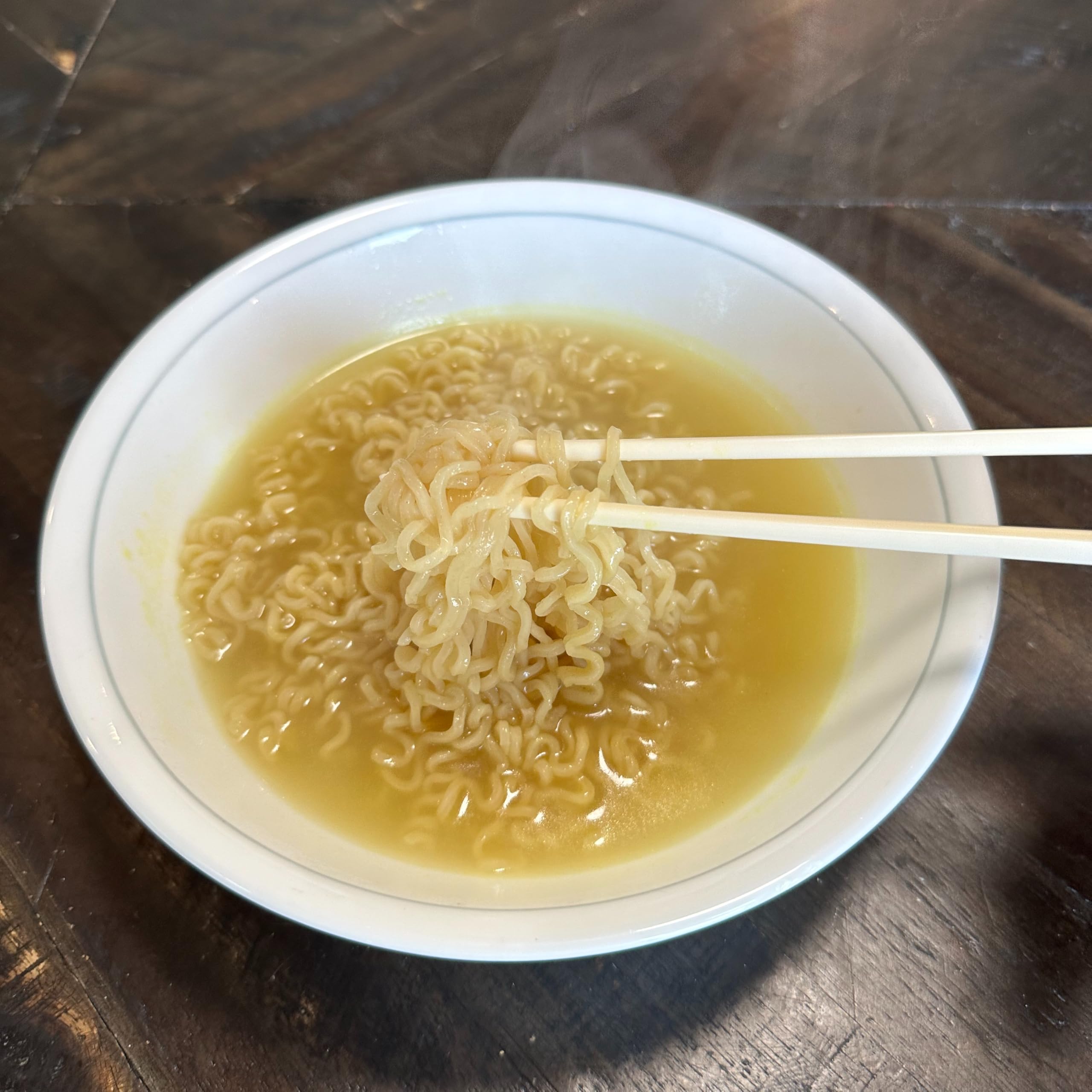 Island Dogs Helping Hands Chopsticks on a dining table illustrate a one-per-package setup.