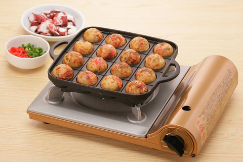 Iwatani Takoyaki grill pan side-profile view demonstrates slim build.
