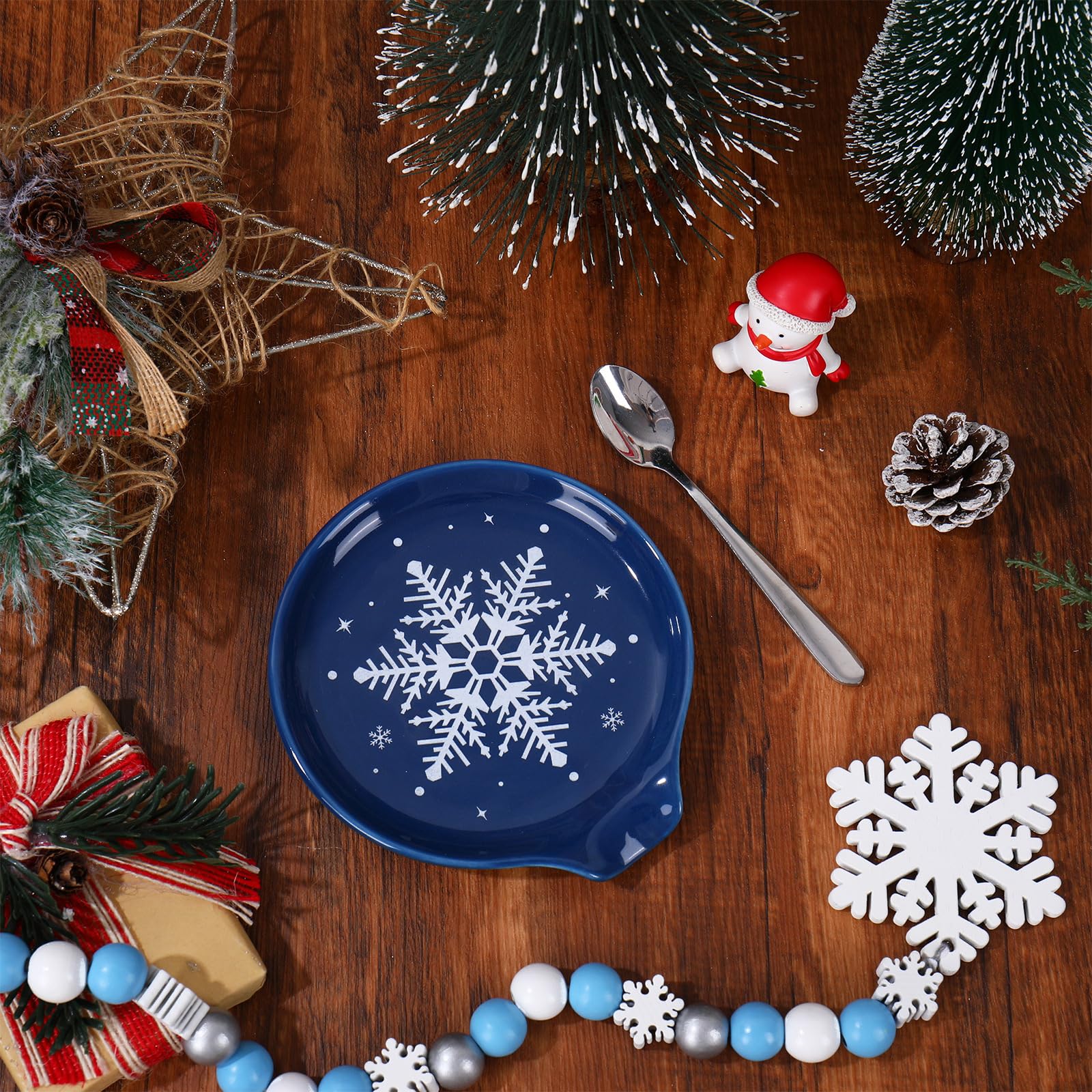 JarThenaAMCS spoon rest adds winter charm to kitchen table decor.