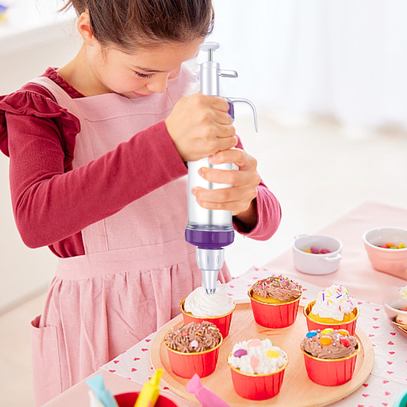 JAYVAR icing gun and couplers enable quick tip changes during decorating.